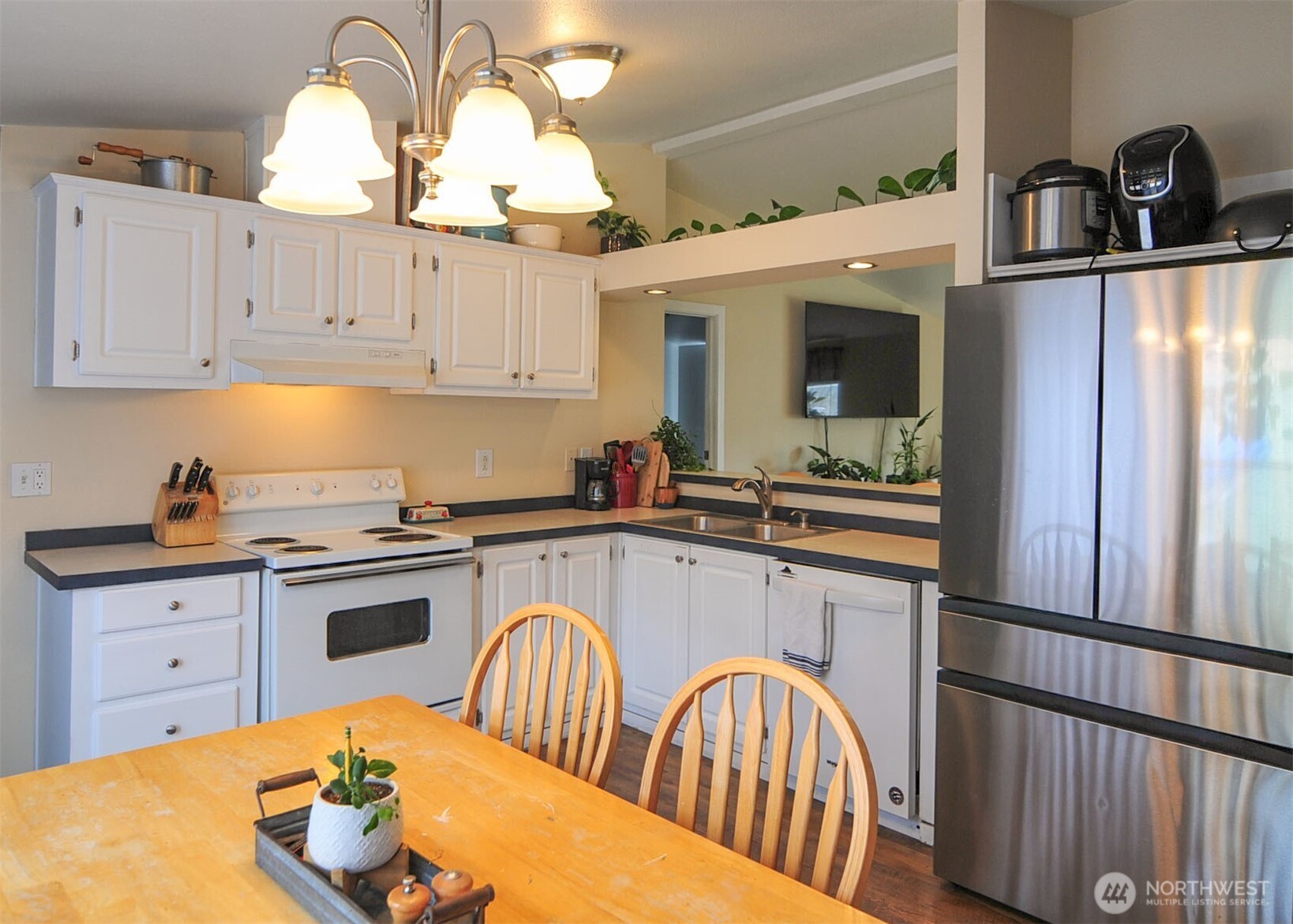 1698 Sunset Drive Wenatchee, WA 98801 - Photo 6 of 22 a kitchen with stainless steel appliances granite countertop a sink a stove and refrigerator