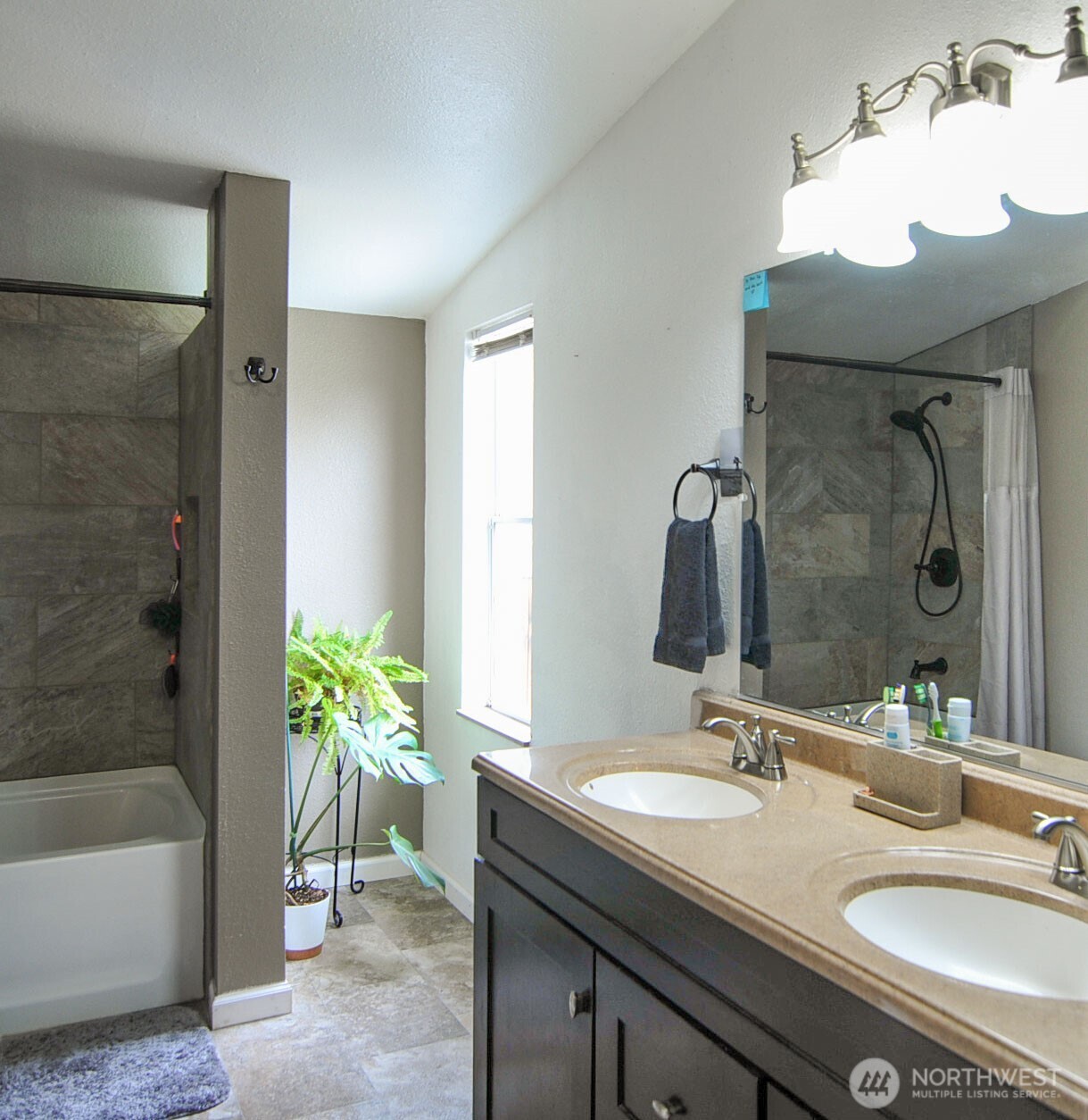 1698 Sunset Drive Wenatchee, WA 98801 - Photo 10 of 22 a bathroom with a sink double vanity granite tub shower and a mirror