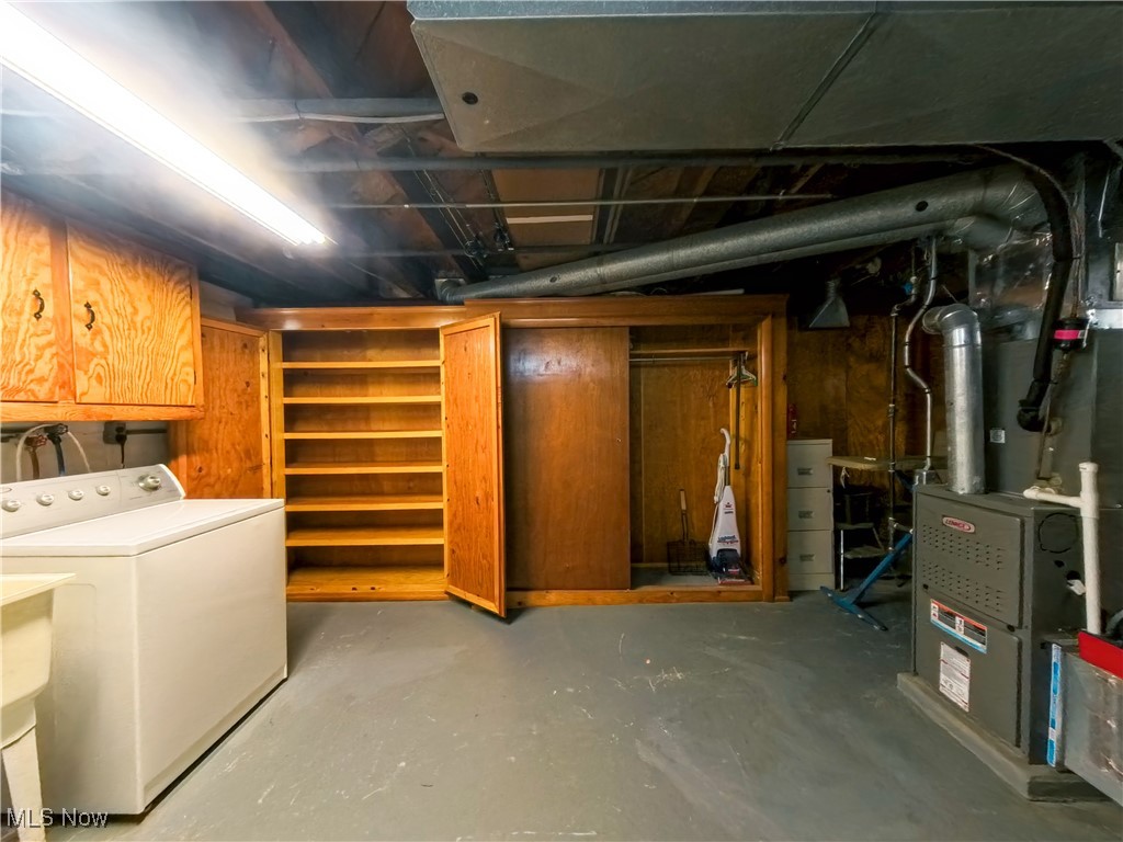 1668 Harwich Road Cleveland, OH 44124 - Photo 18 of 19 Unfinished below grade area with washer / clothes dryer and heating unit