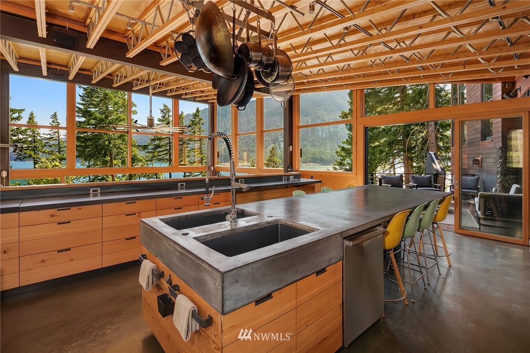 821 Timber Cove Drive Ronald, WA 98940 - Photo 5 of 40 a kitchen with a sink and large windows