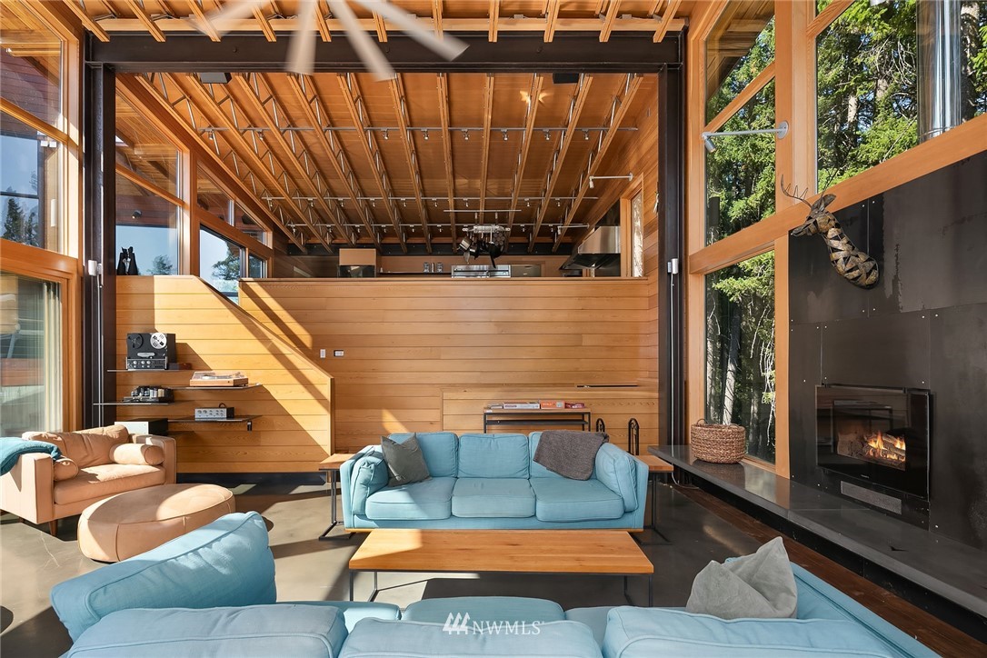 821 Timber Cove Drive Ronald, WA 98940 - Photo 6 of 40 a view of living room with patio furniture and a fireplace