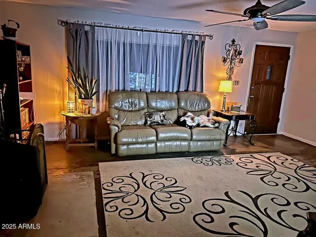 a living room with a couch and a fireplace