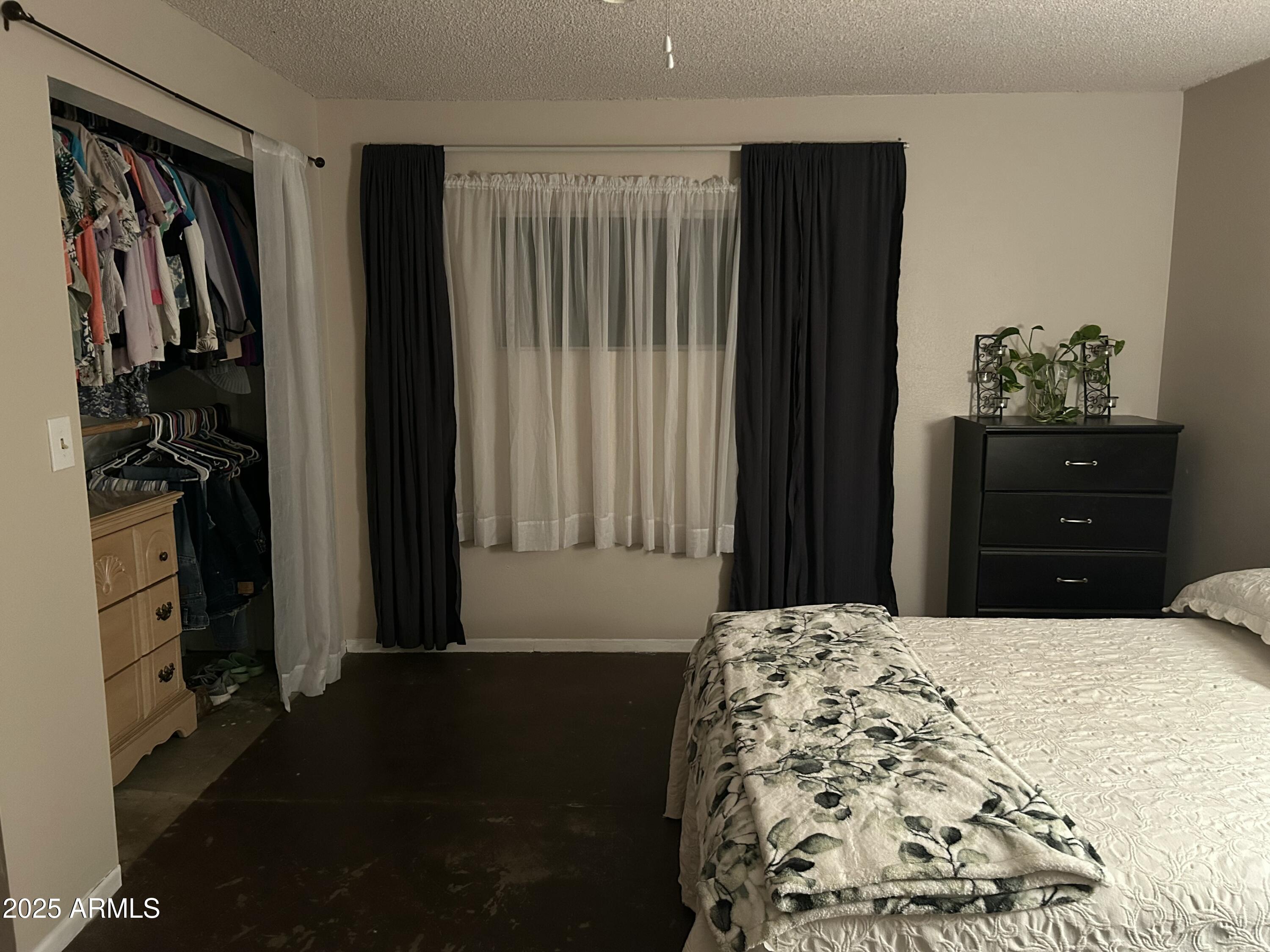 1954 North Bixby Road Globe, AZ 85501 - Photo 15 of 17 a bedroom with a bed and a closet
