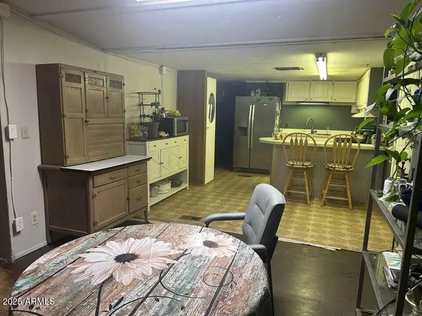 a bedroom with a bed and potted plant