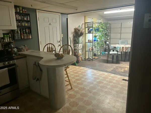 a dining room with a sink and glass door