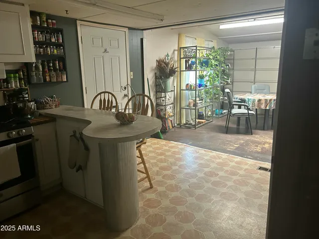 a dining room with a sink and glass door