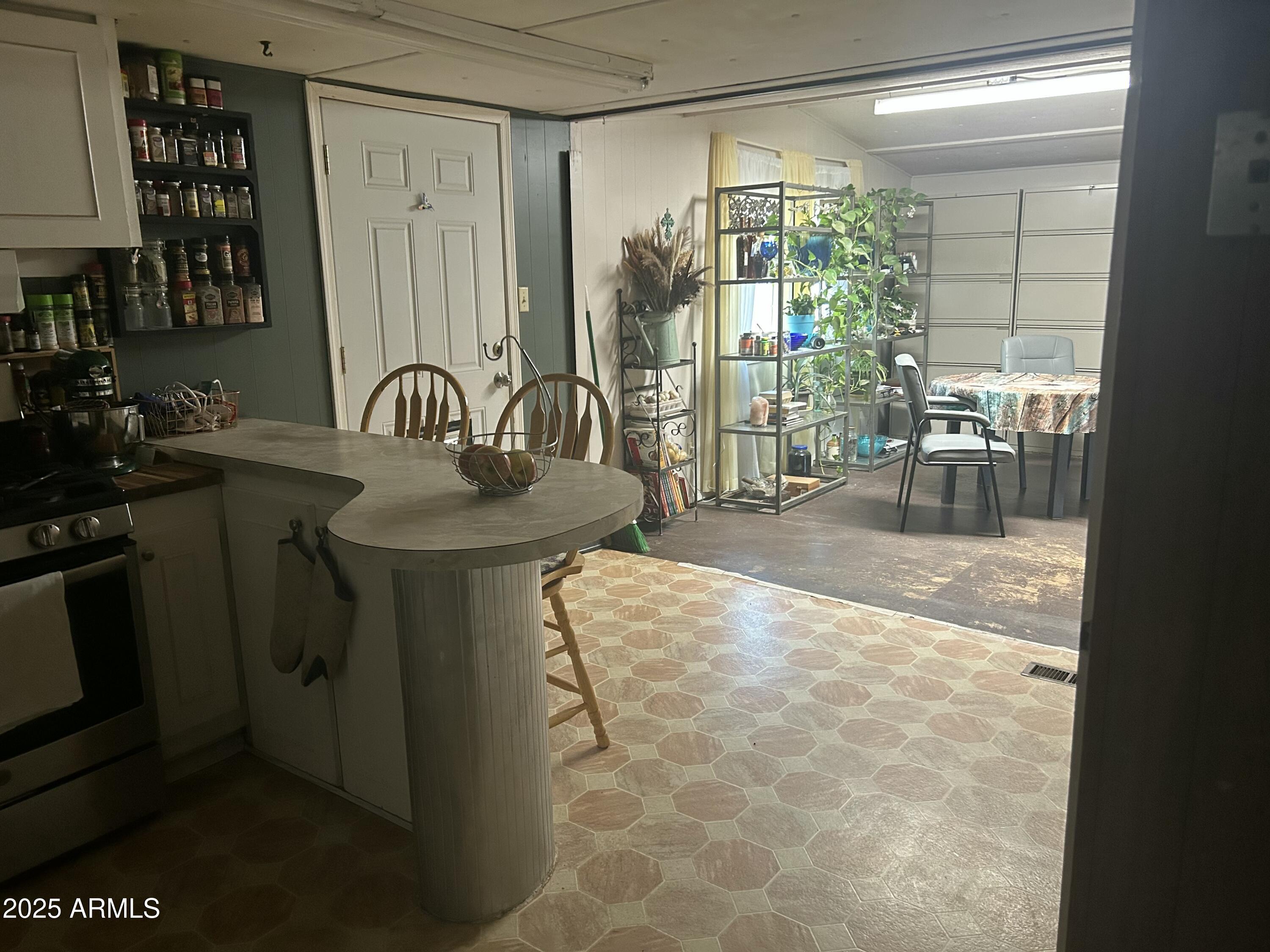 1954 North Bixby Road Globe, AZ 85501 - Photo 6 of 17 a dining room with a sink and glass door