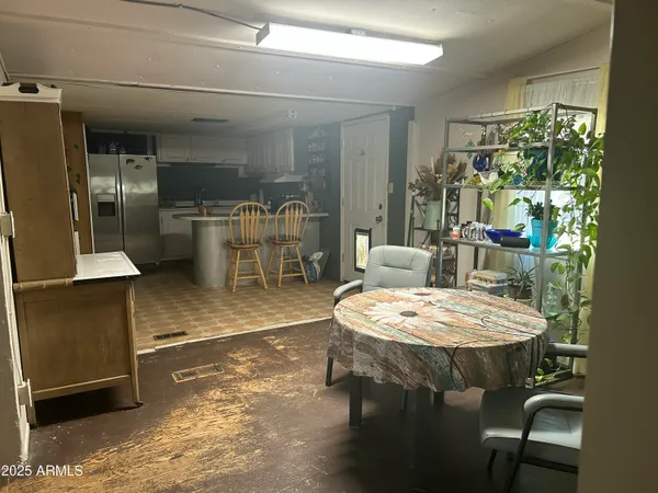 a dining room with a table and chairs