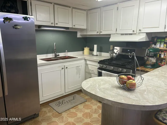 a kitchen with a sink and cabinets