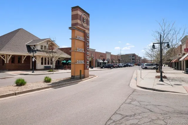 a view of street with tall buildings
