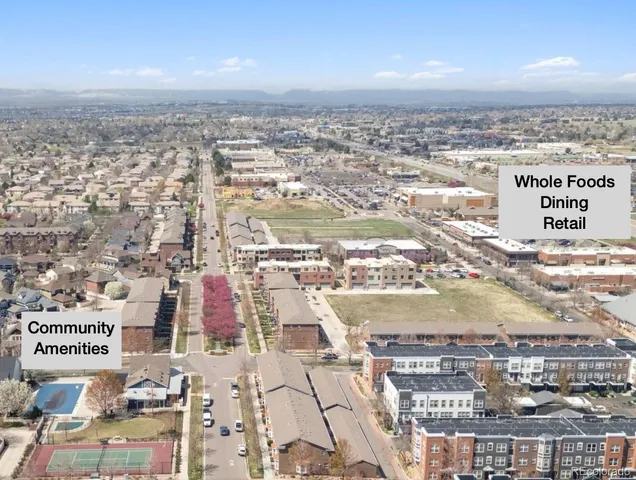 an aerial view of residential building and ocean