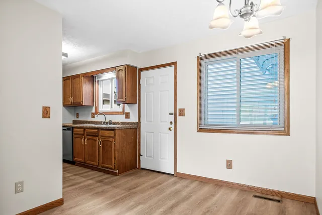 a kitchen with stainless steel appliances granite countertop a stove and a refrigerator