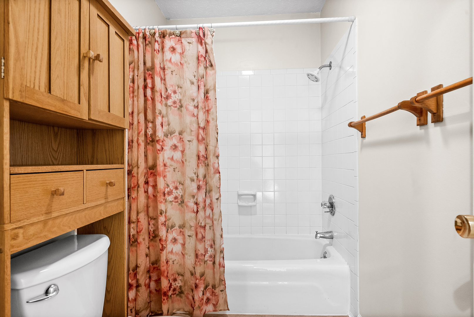 1402 Keller Road Normal, IL 61761 - Photo 23 of 30 a bathroom with a shower curtain and a bathtub