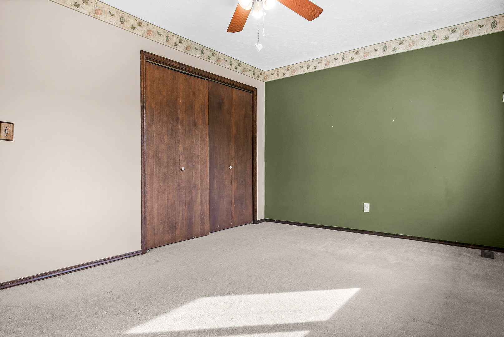 1402 Keller Road Normal, IL 61761 - Photo 25 of 30 a view of a room with a ceiling fan and a window