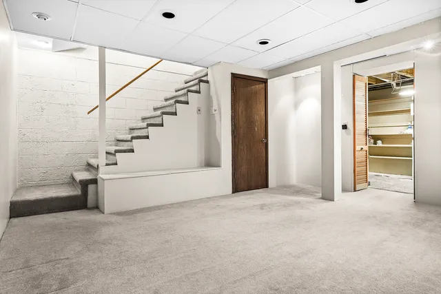 a view of an empty room with a ceiling fan