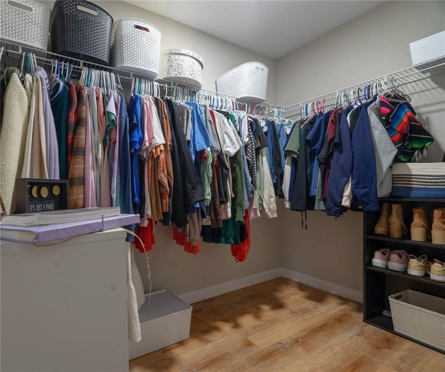 735 Walnut Creek Circle Pendergrass, GA 30567 - Photo 20 of 29 a view of walk in closet with clothes and shoes