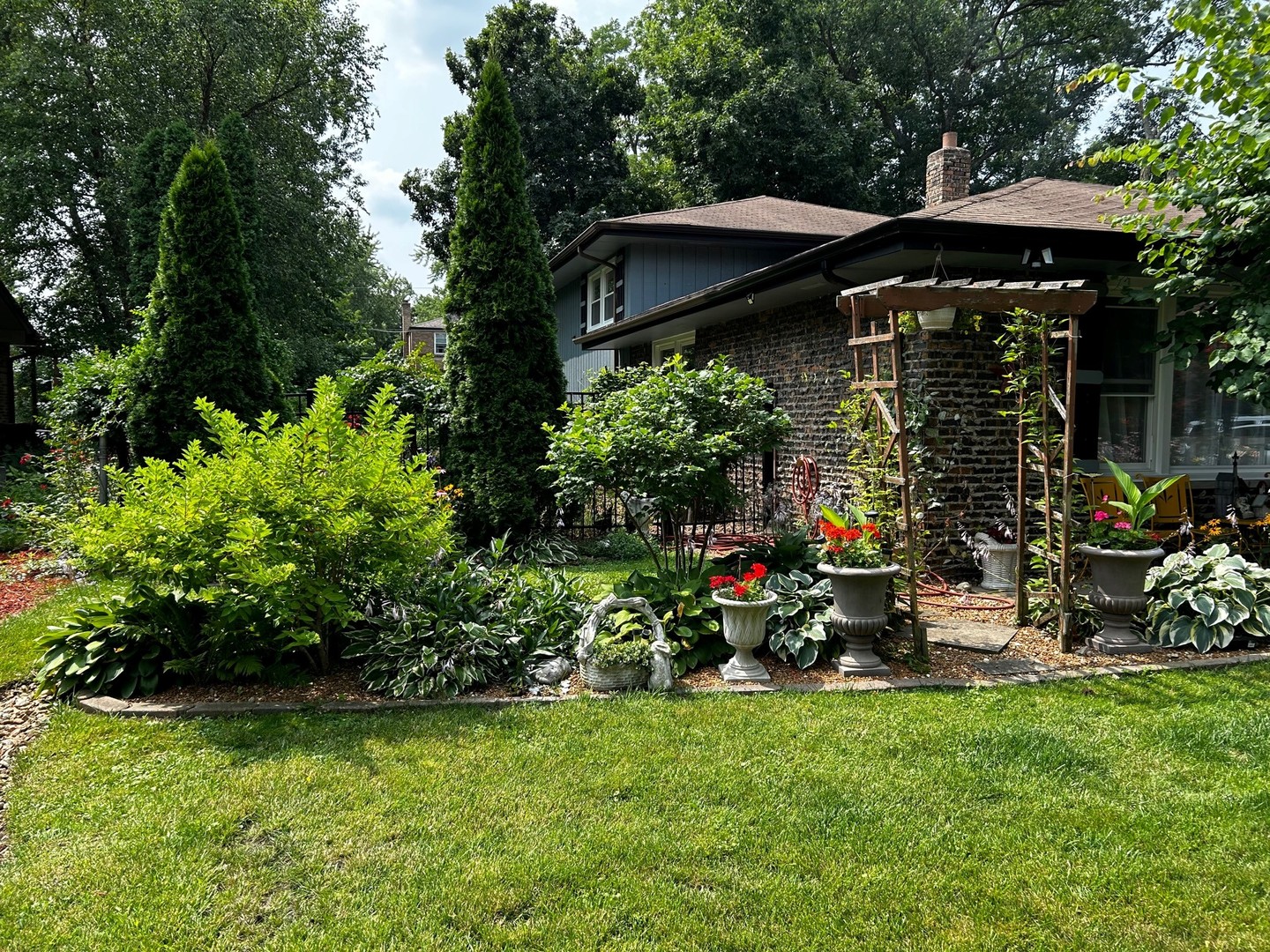 116 Alpine Lane Crete, IL 60417 - Photo 3 of 19 a view of a chair and table under an umbrella