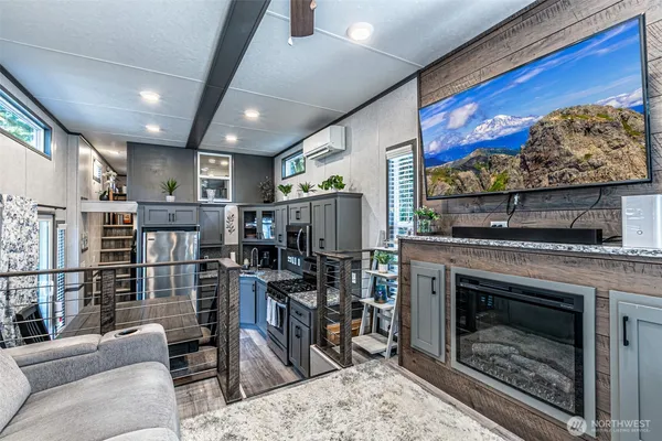 a living room with lots of furniture and fireplace