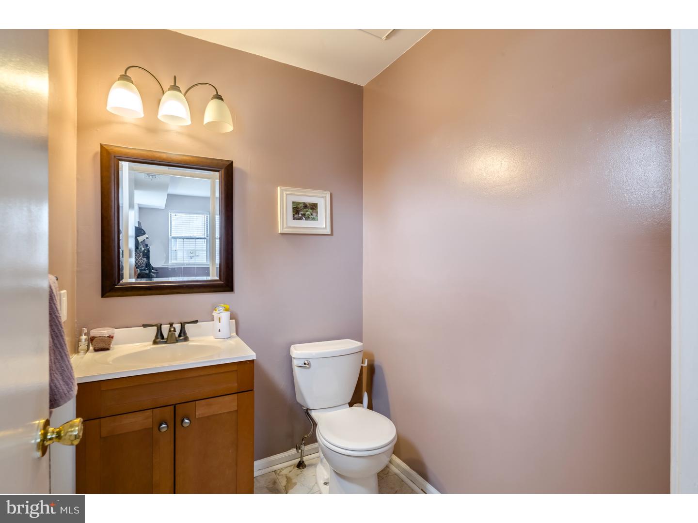12 Derby Road Logan Township, NJ 08085 - Photo 14 of 23 a bathroom with a toilet sink vanity and mirror