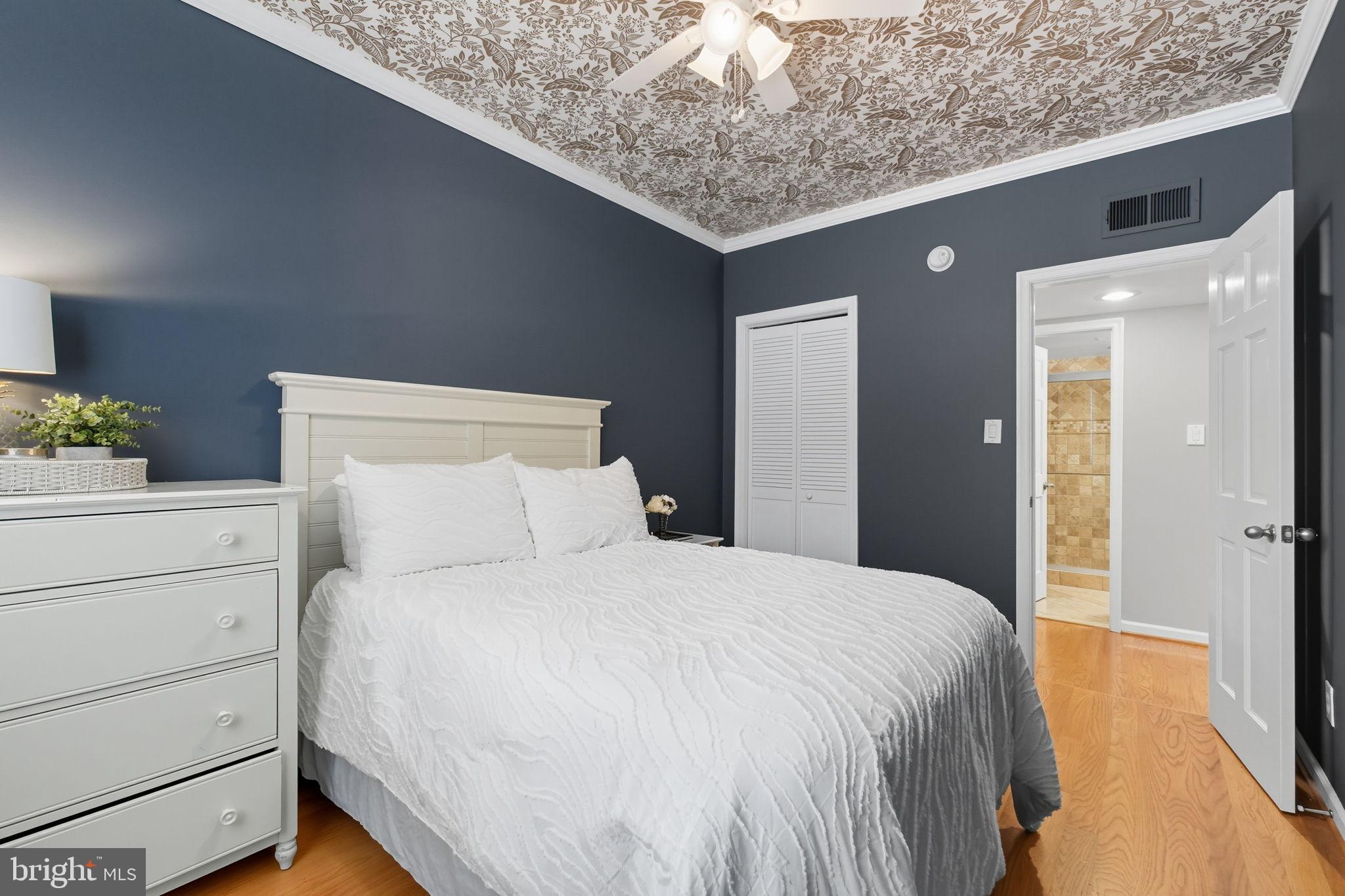 1669 Columbia Road Northwest, Unit 203 Washington, DC 20009 - Photo 13 of 18 a bedroom with a bed and cabinet