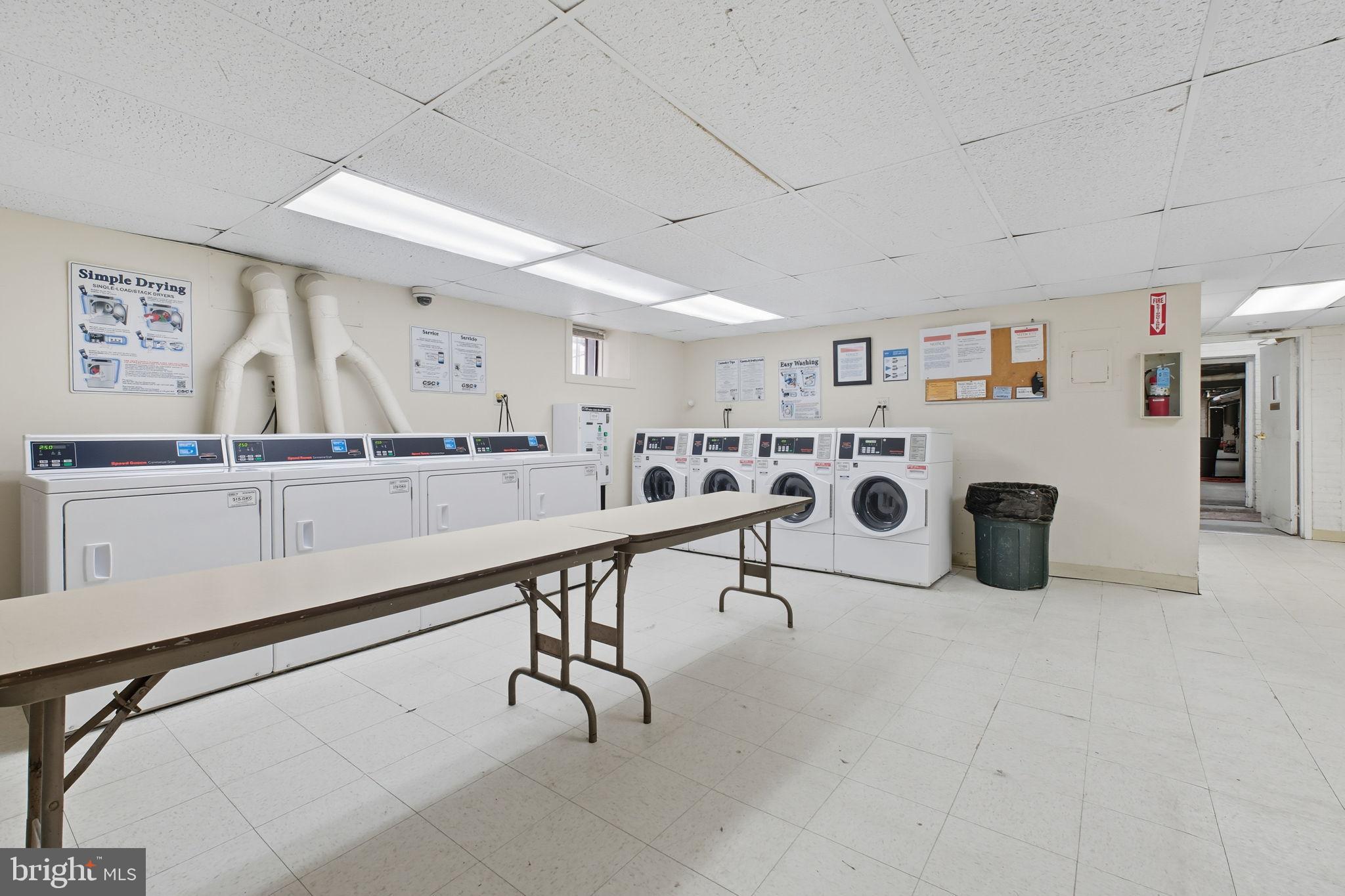 1669 Columbia Road Northwest, Unit 203 Washington, DC 20009 - Photo 16 of 18 a work room with furniture a rug and white walls