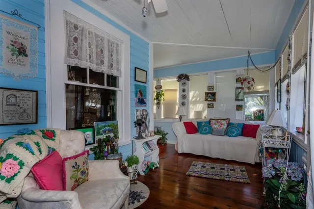 a living room with furniture rug and window