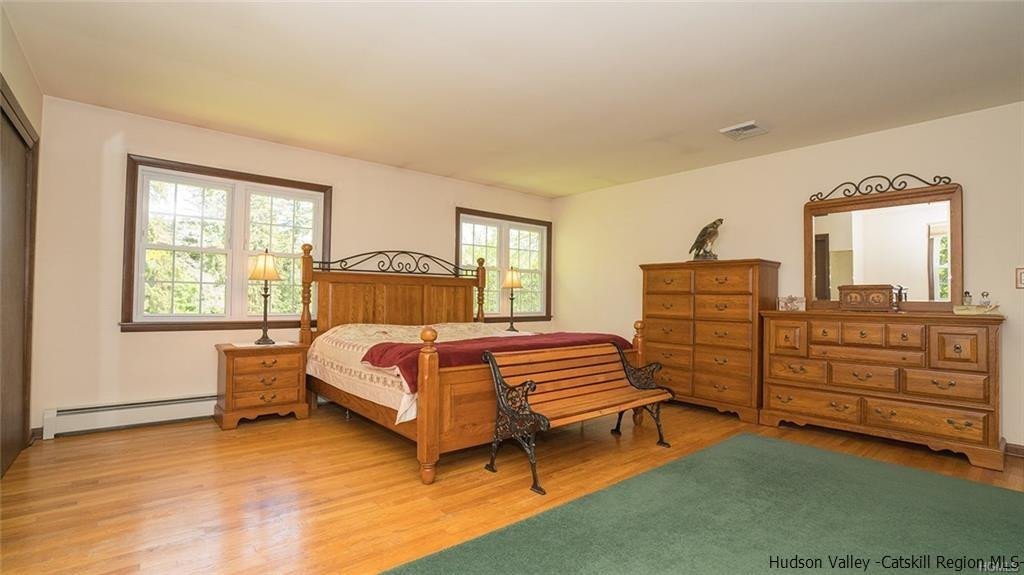 20 Van Orden Road Milton, NY 12547 - Photo 21 of 32 a bedroom with a bed and a dresser