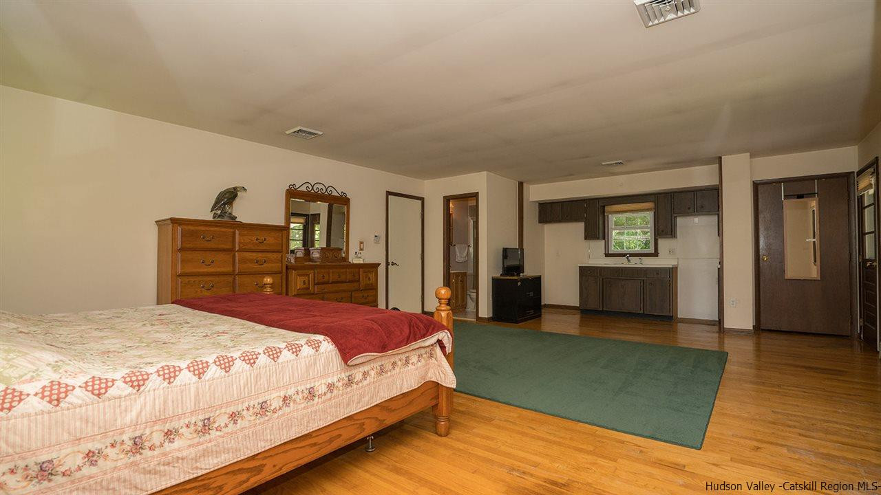 20 Van Orden Road Milton, NY 12547 - Photo 22 of 32 a bedroom with a bed and a dresser