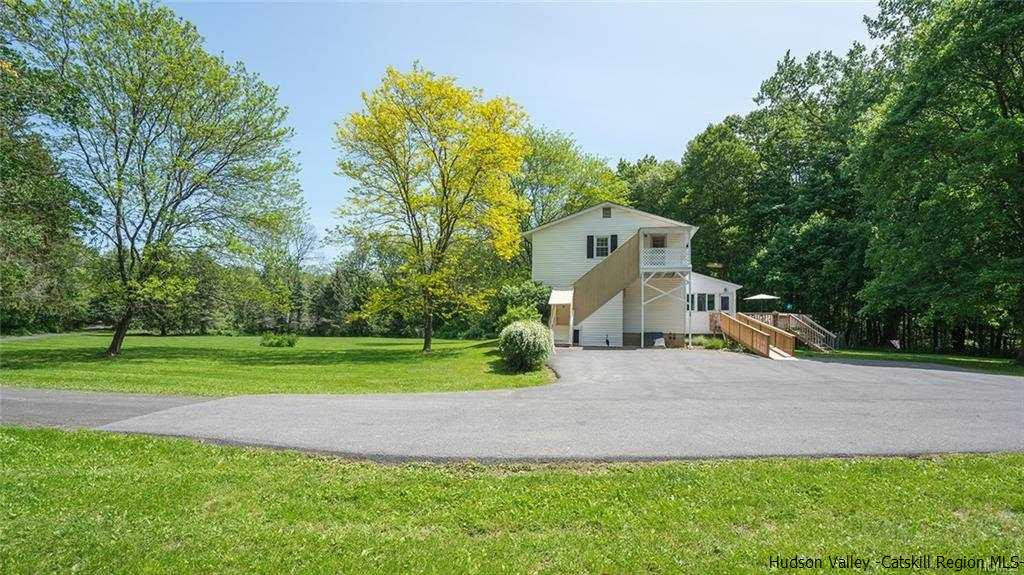 20 Van Orden Road Milton, NY 12547 - Photo 25 of 32 a front view of a house with a yard and trees