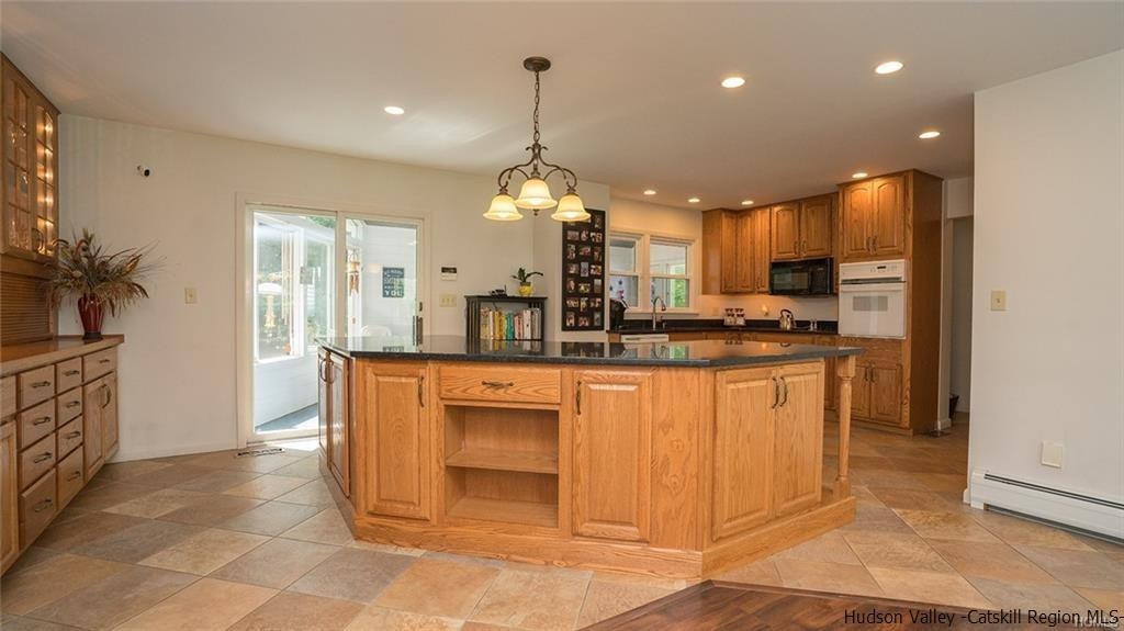 20 Van Orden Road Milton, NY 12547 - Photo 5 of 32 a kitchen with stainless steel appliances granite countertop a stove a sink a refrigerator and a microwave