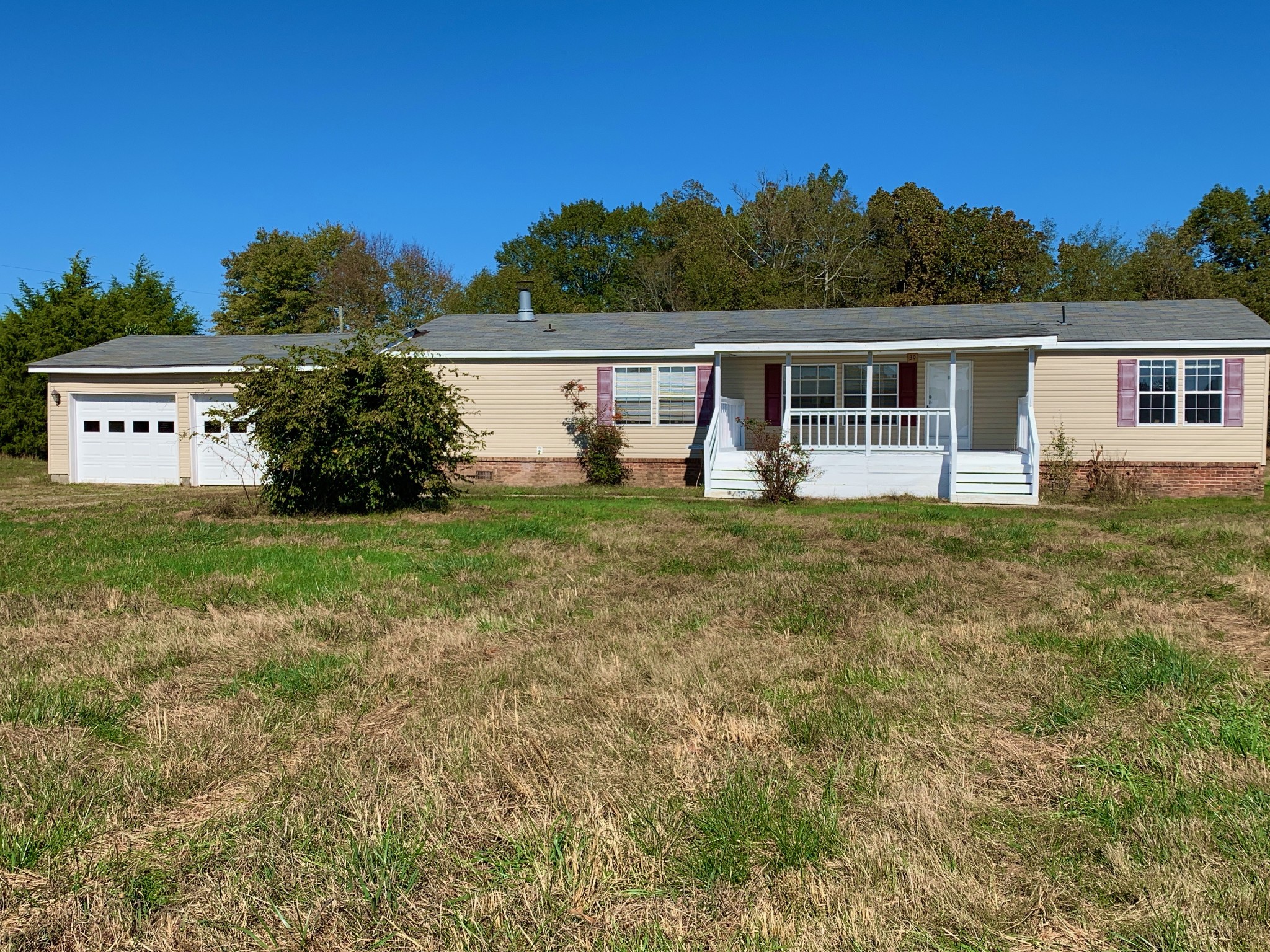 39 Bolling Road Ardmore, TN 38449 - Photo 1 of 24 a view of a house with yard and a garden