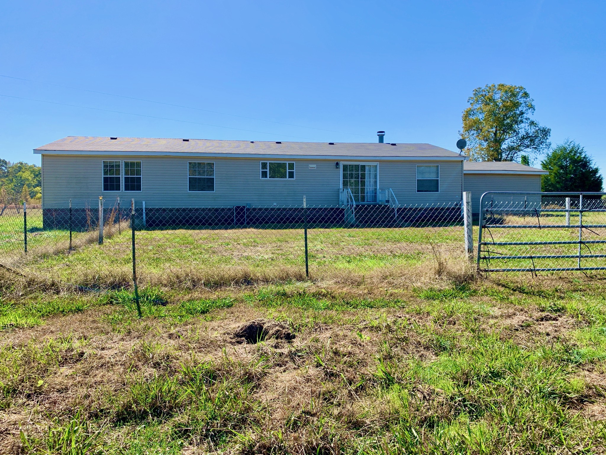 39 Bolling Road Ardmore, TN 38449 - Photo 3 of 24 a view of a house with a backyard