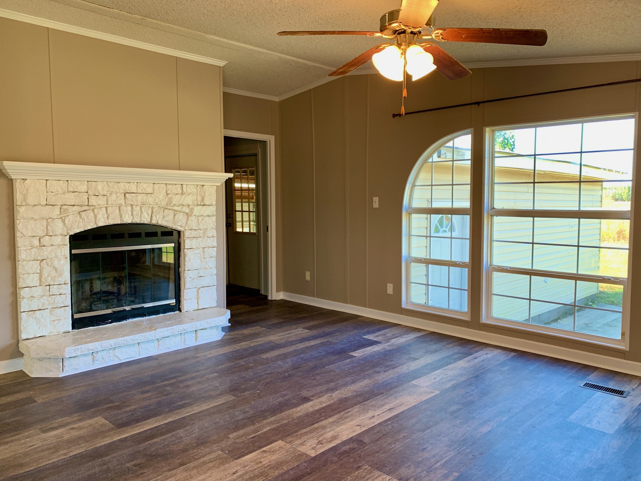 39 Bolling Road Ardmore, TN 38449 - Photo 4 of 24 wooden floor fireplace and windows in an empty room