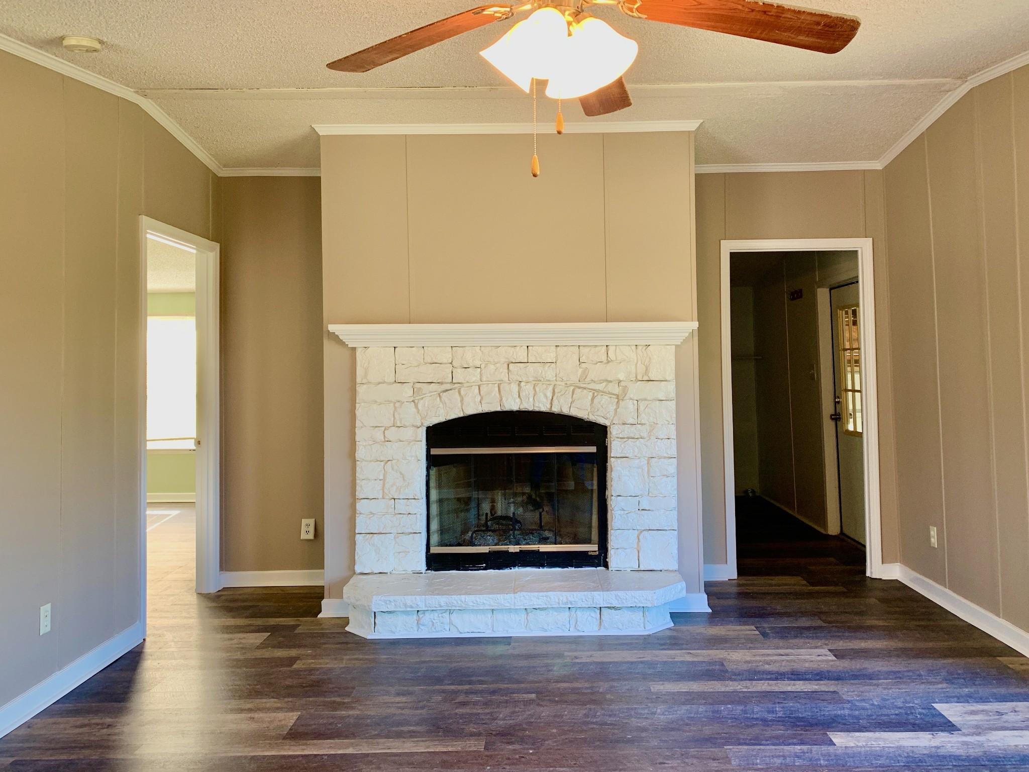 39 Bolling Road Ardmore, TN 38449 - Photo 5 of 24 a living room with a fireplace and a ceiling fan