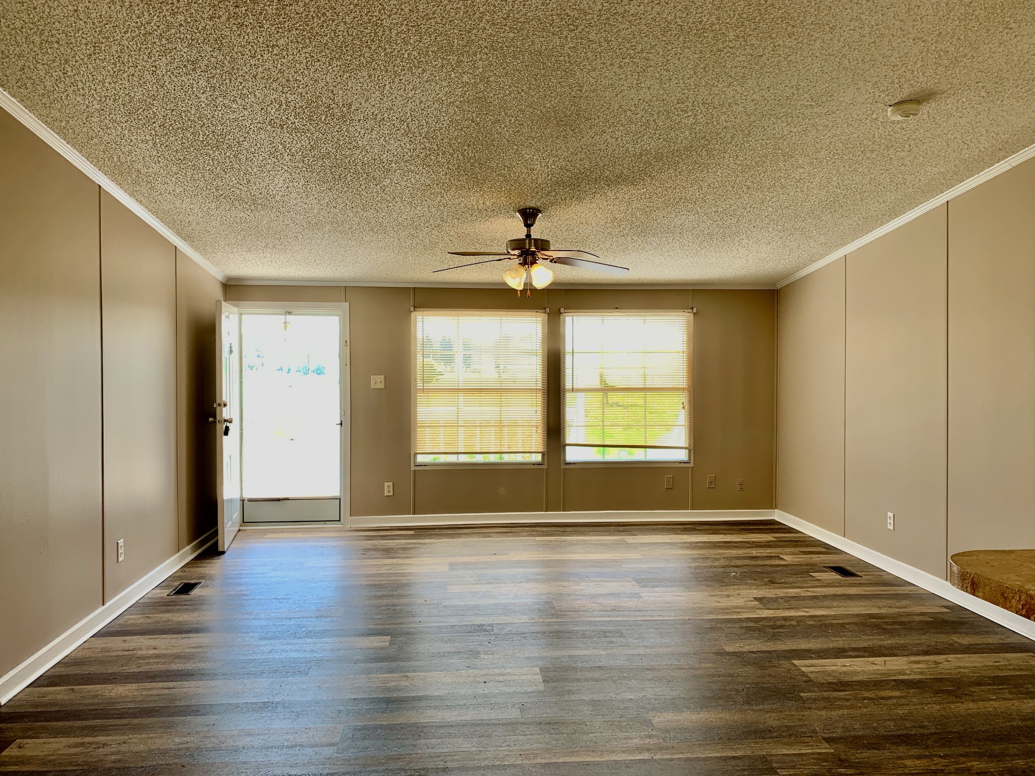 39 Bolling Road Ardmore, TN 38449 - Photo 8 of 24 a view of empty room with wooden floor and fan