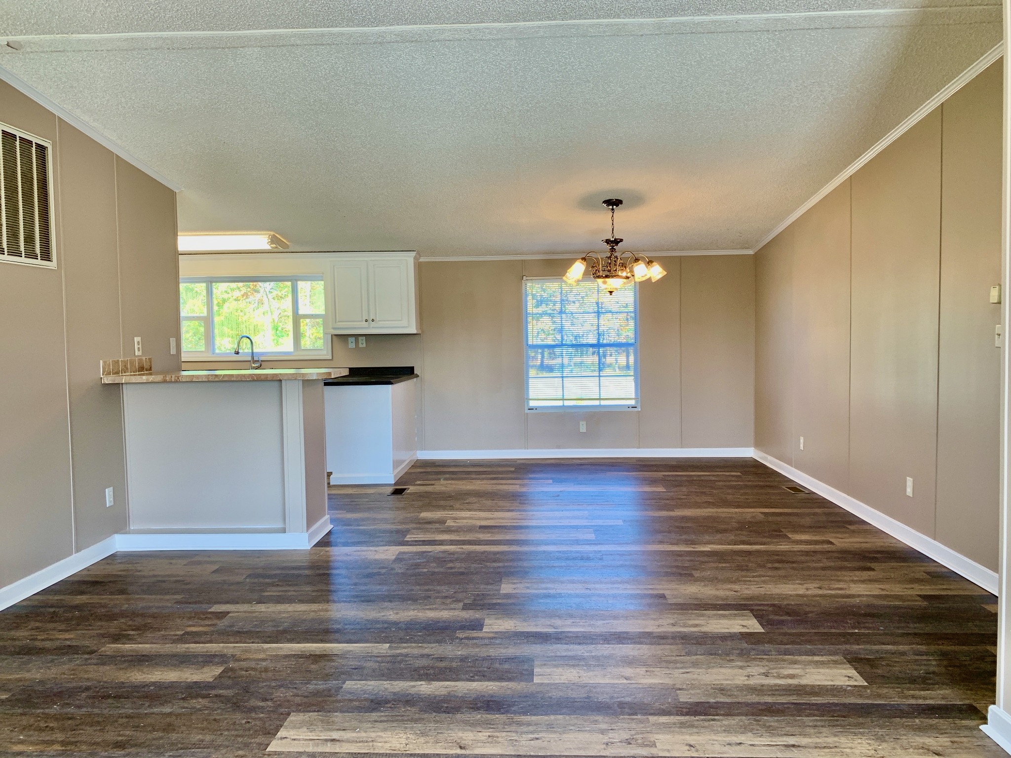 39 Bolling Road Ardmore, TN 38449 - Photo 9 of 24 wooden floor in an empty room with a window