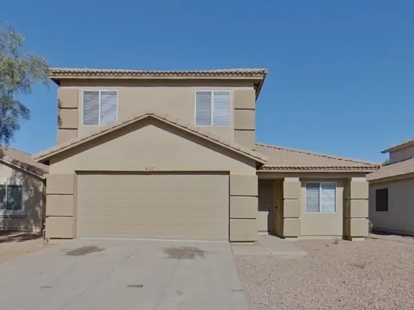 a house with white door of garage