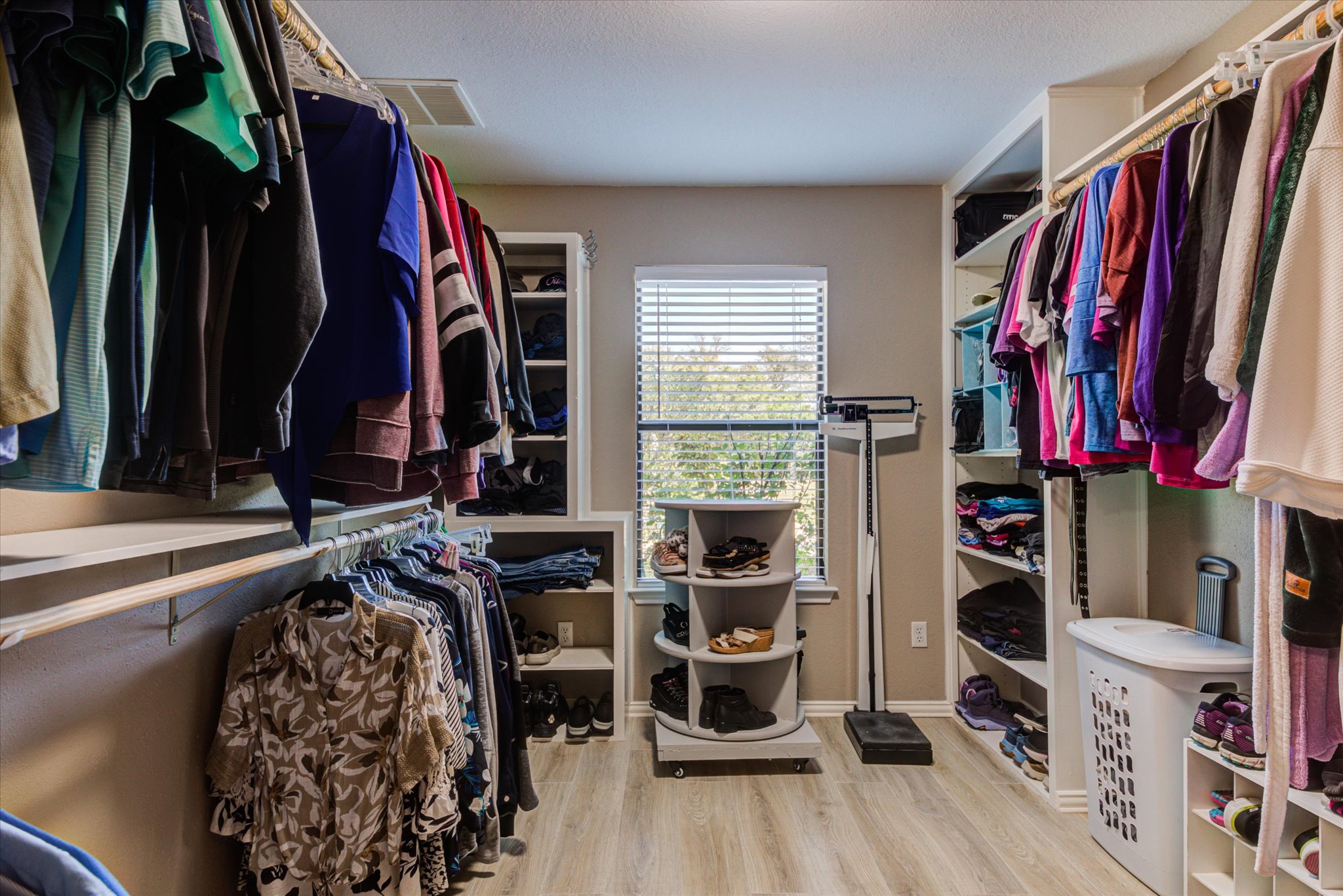 200 Harbor Circle Georgetown, TX 78633 - Photo 15 of 38 a view of walk in closet with clothes and shoes