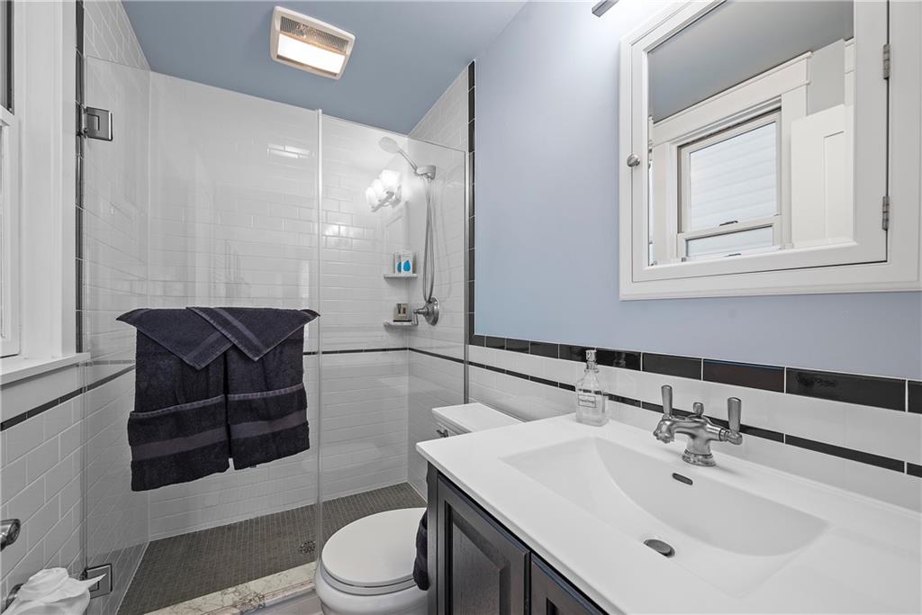 706 Ivy Street, Unit 1 Pittsburgh, PA 15232 - Photo 25 of 35 a bathroom with a sink a toilet and shower