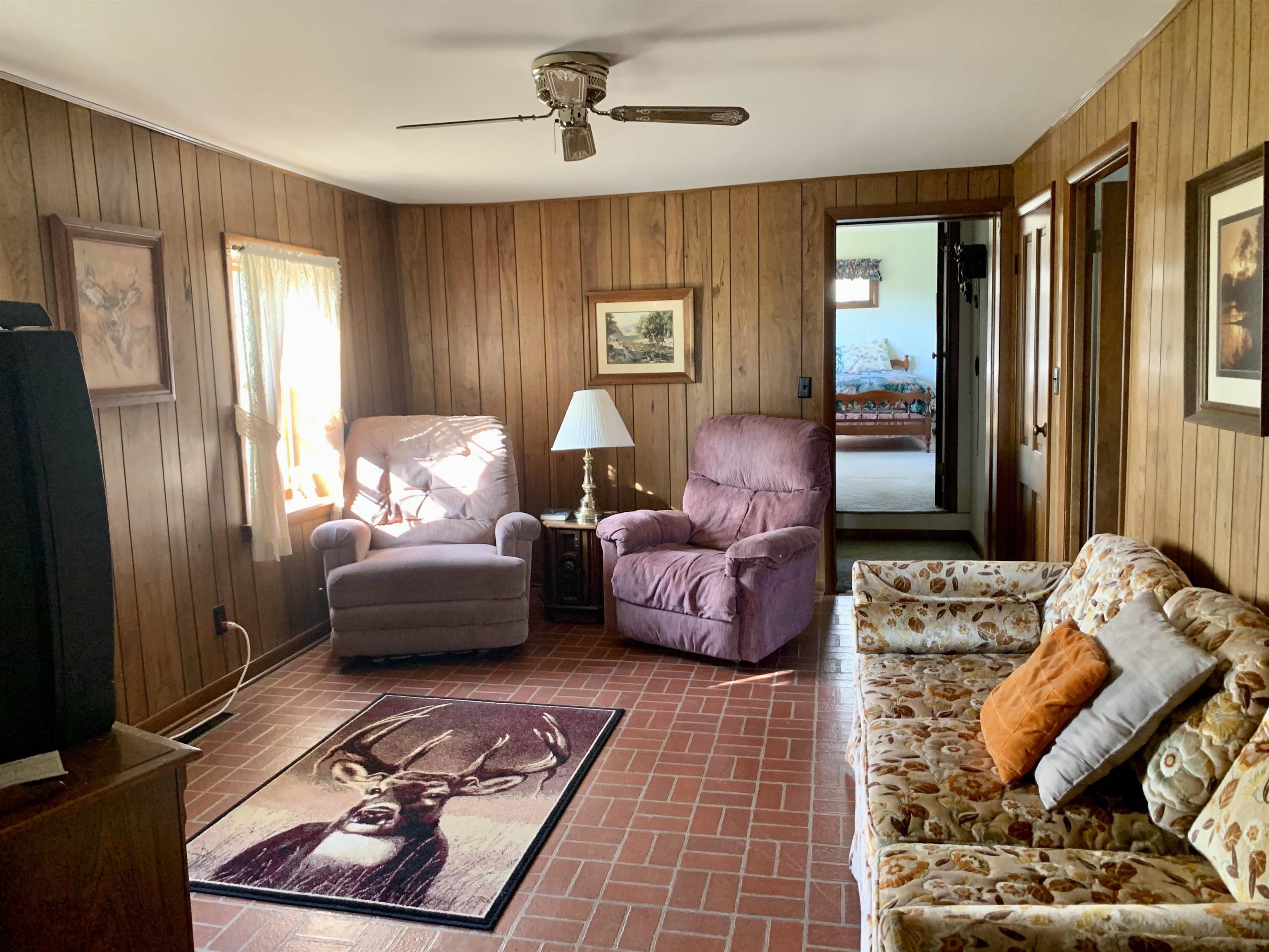 6569 South Speer Road Hanover, IL 61041 - Photo 13 of 59 a bedroom with furniture and wooden floor