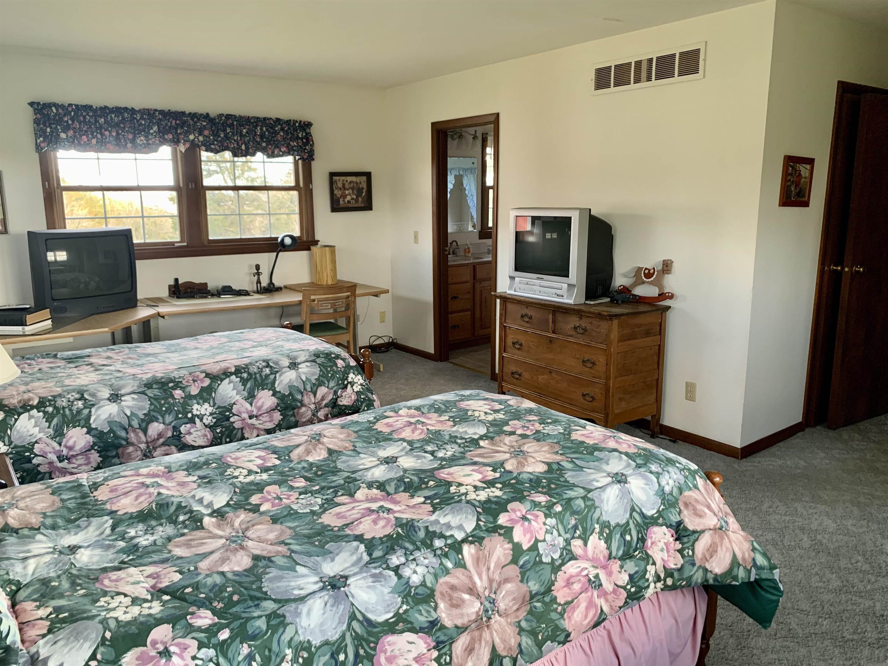 6569 South Speer Road Hanover, IL 61041 - Photo 16 of 59 a bedroom with a bed and a dresser in it