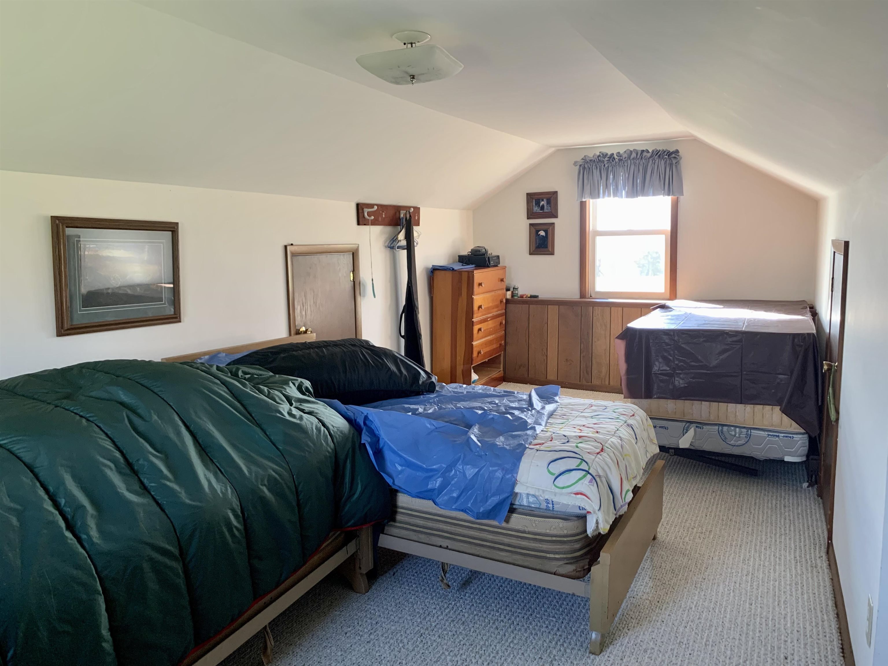 6569 South Speer Road Hanover, IL 61041 - Photo 22 of 59 a bedroom with a bed and a window