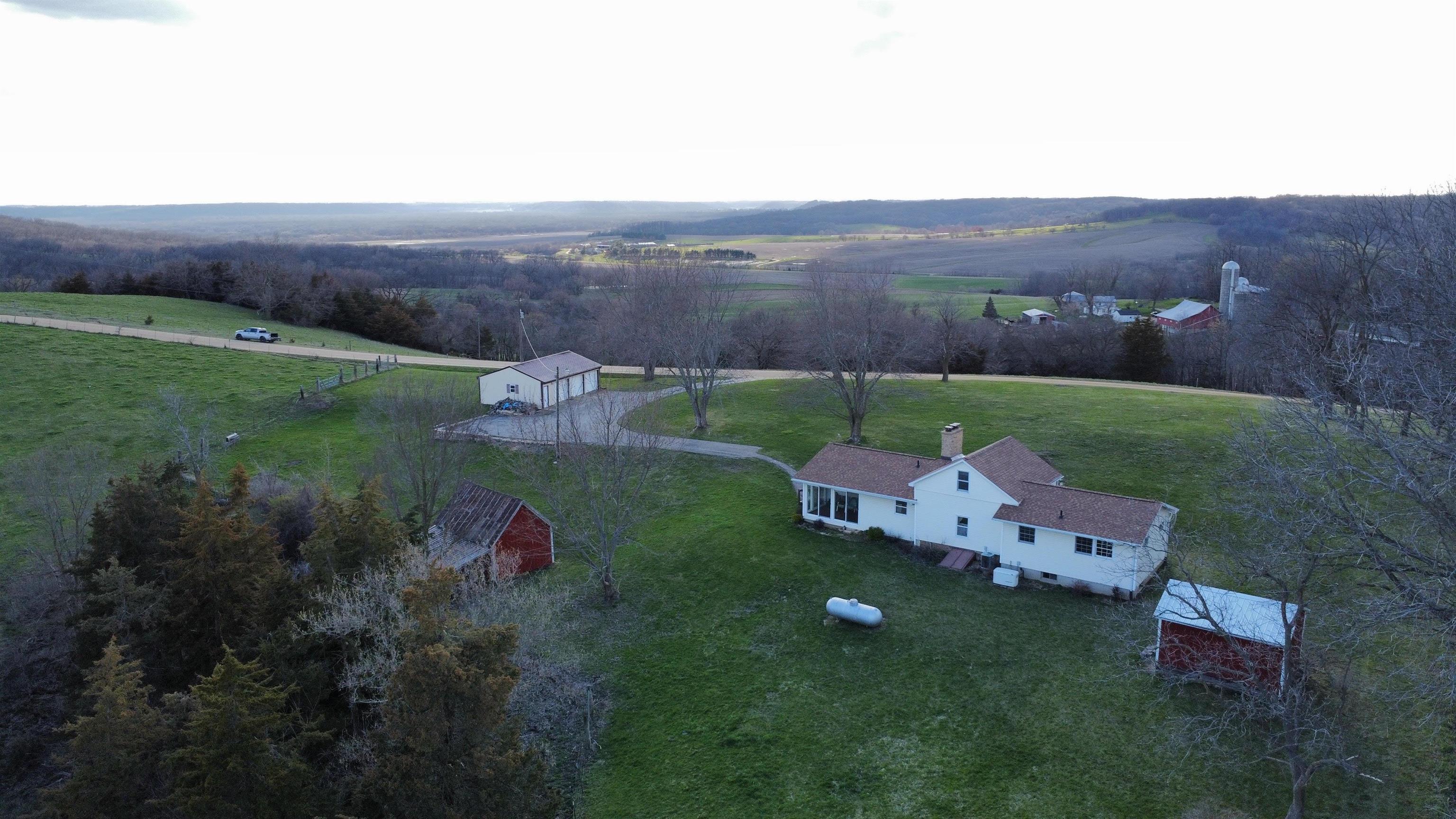 6569 South Speer Road Hanover, IL 61041 - Photo 24 of 59 an aerial view of a house with yard