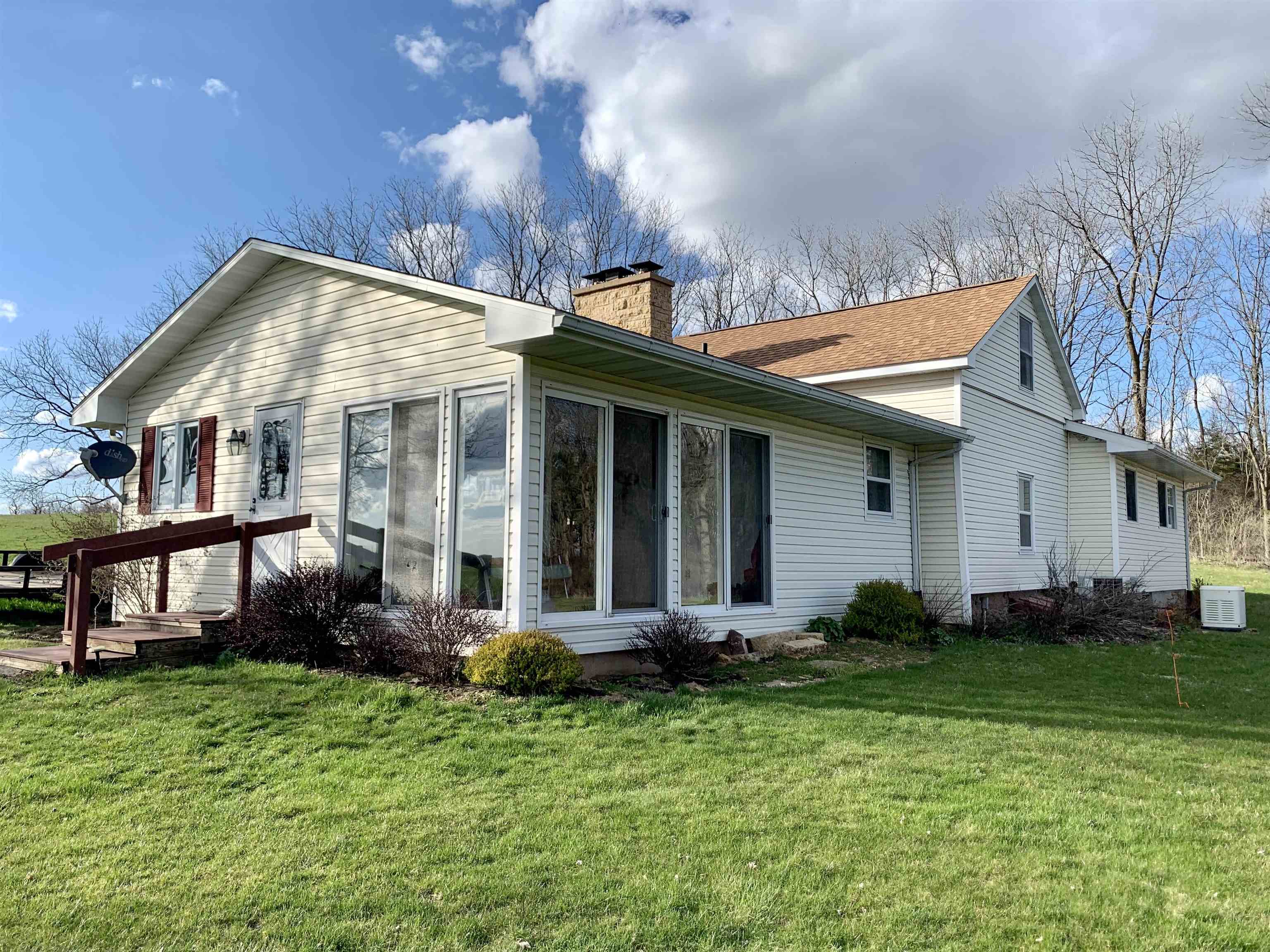 6569 South Speer Road Hanover, IL 61041 - Photo 6 of 59 a front view of a house with garden