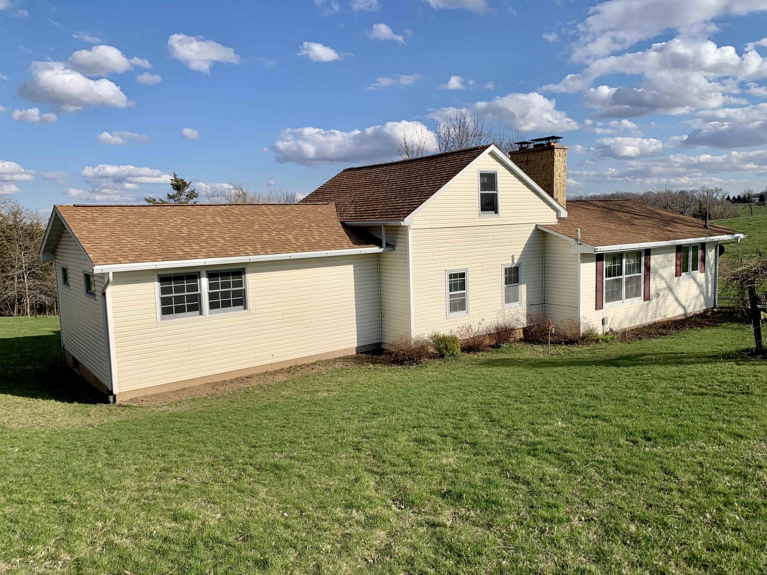 6569 South Speer Road Hanover, IL 61041 - Photo 7 of 59 a view of a house with a yard