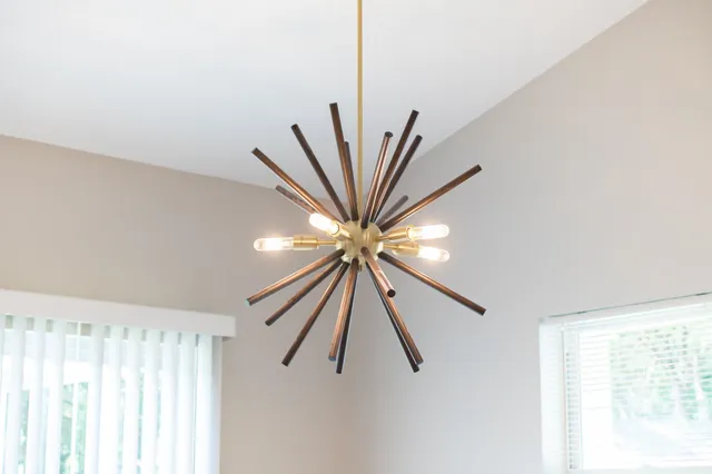 a view of a room with window and a ceiling fan