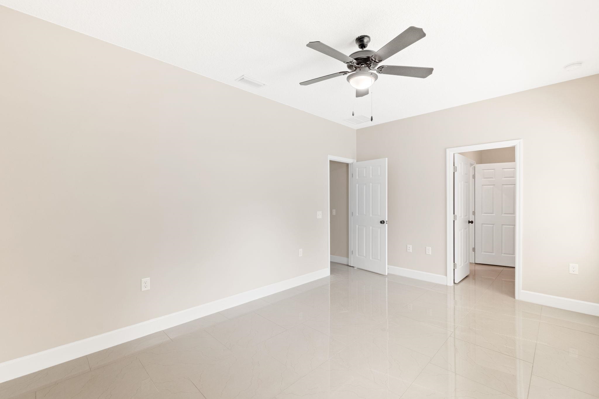 2770 Schaller Road St. Augustine, FL 32084 - Photo 23 of 29 an empty room with closet and ceiling fan