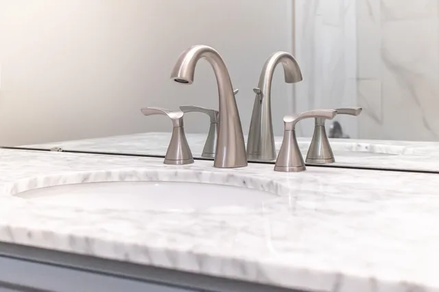 a front view of a house with a yard table and chairs