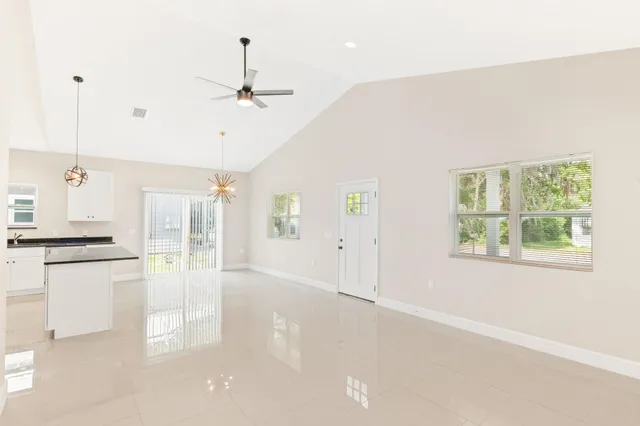 a view of a kitchen with a stove cabinets and a wooden floor
