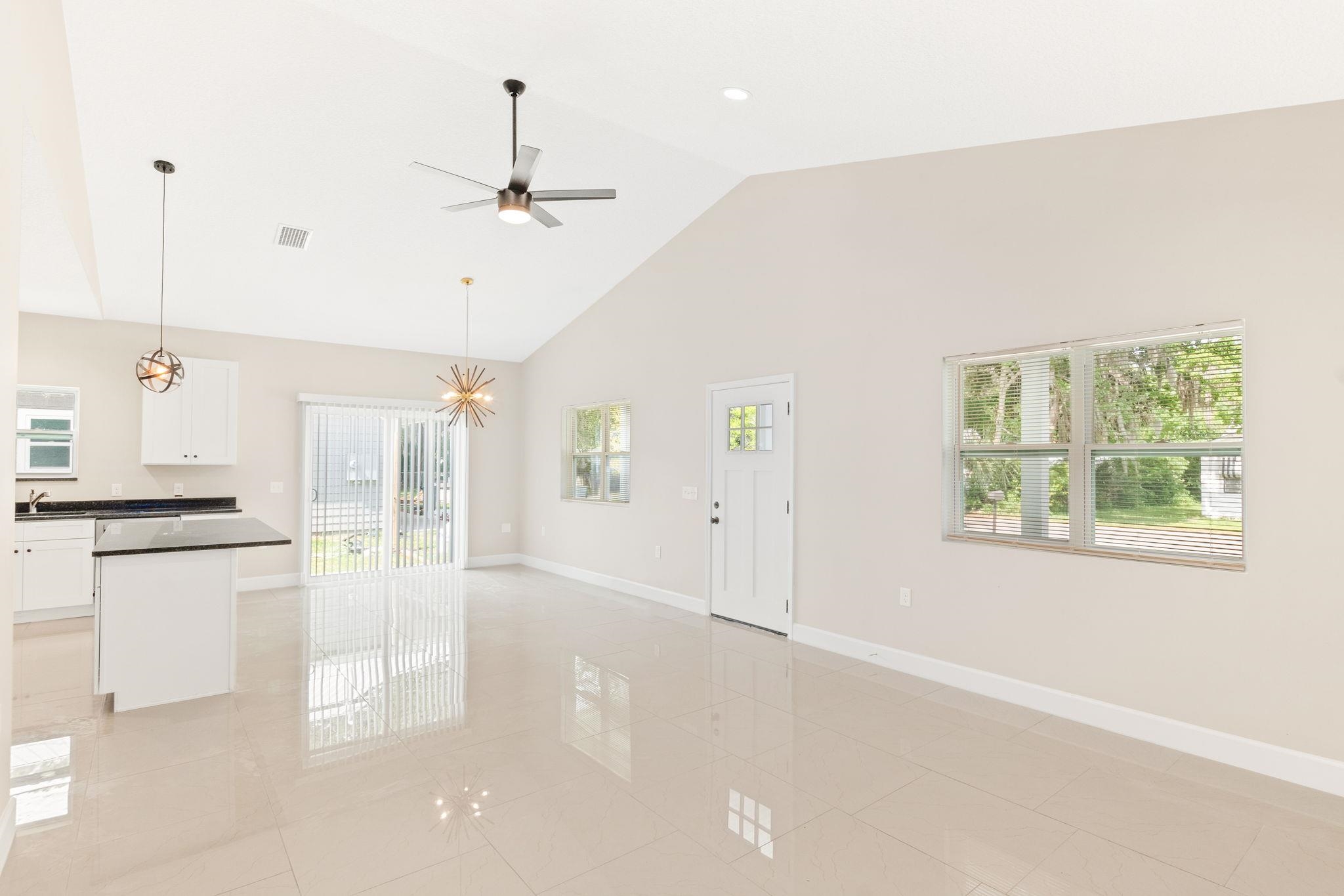 2770 Schaller Road St. Augustine, FL 32084 - Photo 8 of 29 a view of a kitchen with a stove cabinets and a wooden floor